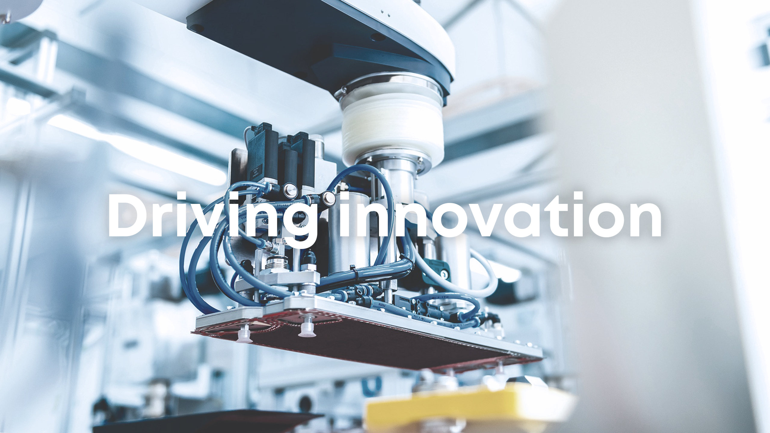 Industrial robotic arm in hydrogen production environment, text “Driving Innovation